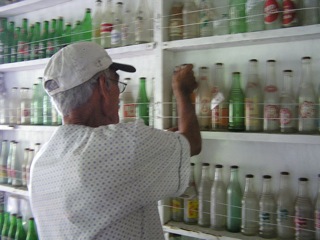 Don Pedro selecting a bottle